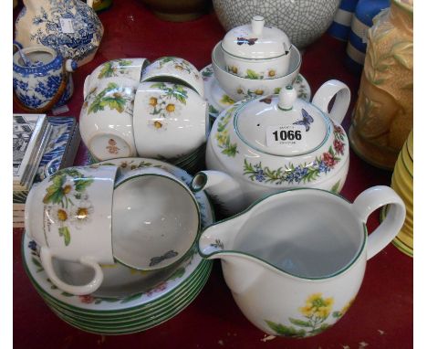 A quantity of Royal Worcester oven-to-tableware decorated in the 'Worcester Herb' pattern including teapot, milk jug, cups an