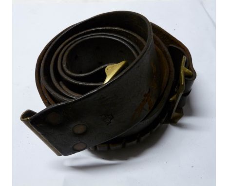 A WWII leather military belt with three crowns embossed by the buckle - sold with another marked with 1943 S