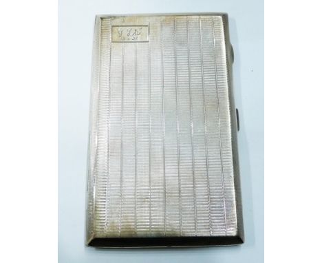 A silver cigarette case with engine turned decoration and personailised cartouche