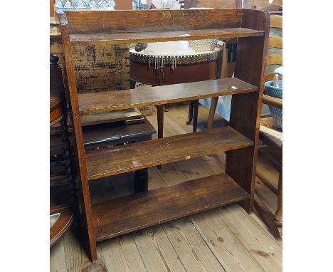 A 77cm vintage oak four shelf open bookcase