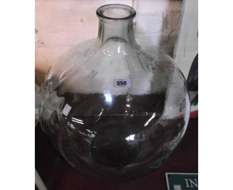 A large vintage glass carboy