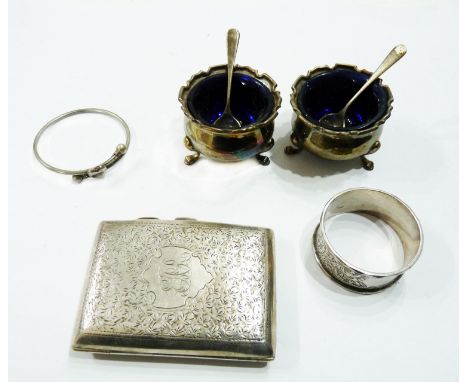 A pair of silver salts with blue glass liners and original spoons - sold with a silver cigarette case, napkin ring and a whit