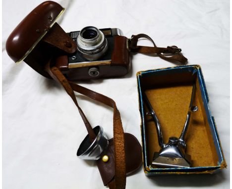 A vintage West German Voigtlander camera with instruction manual in leather case - sold with a pair of Fagan ladies' hair cli