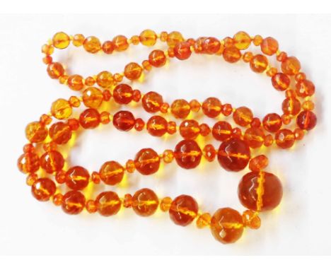 A vintage orange amber graduated bead necklace