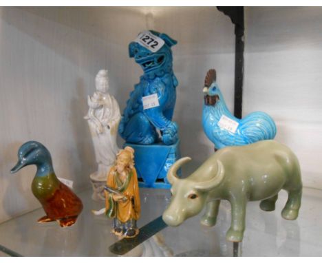 Six late Oriental ceramic animals and figurines including a celadon glazed water buffalo and an early 20th Century Chinese bl