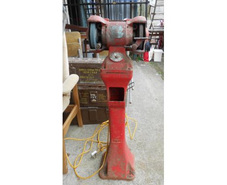 A vintage Wolf freestanding bench grinder