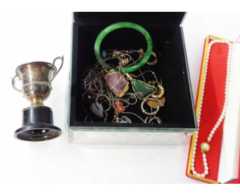 A mirror clad jewellery box containing white metal jewellery and other jewellery, jadeite bangle, a boxed string of Chinese c