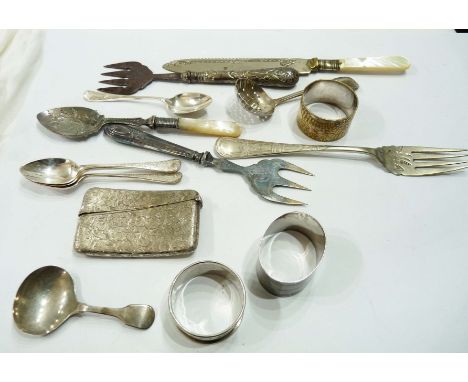 A silver card case with engraved decoration and initials, two silver napkin rings (personalised) and a silver caddy spoon - s