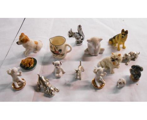 A tub containing a quantity of assorted ceramic and other figurines including Hjorth Bear, wedding cake cavorting putti decor