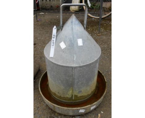 A vintage Eltex galvanised chicken feeder
