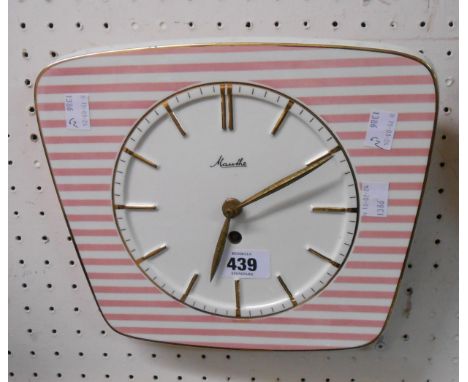 A mid 20th Century Mauthe ceramic framed wall timepiece with pink striped decoration and front wind mechanical movement