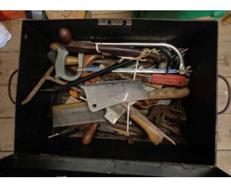 A metal trunk containing a quantity of assorted tools including Henry Disston saw, Elwell bill hook, files, etc.