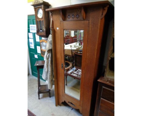 Oak Arts & Crafts Single wardrobe with carved detail and bevel edge mirror