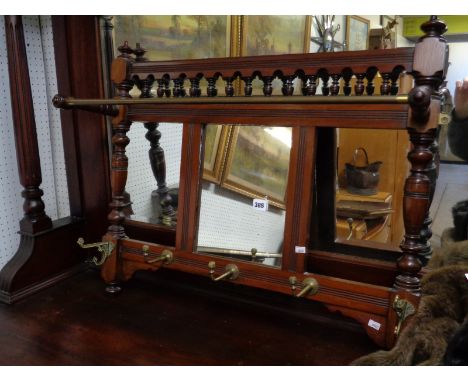 Edwardian Mahogany Turned wall mounted coat rack with brass fittings