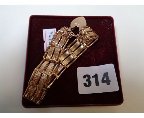 Ladies Edwardian Rose Gold decorative gate bracelet with locket 28g total weight