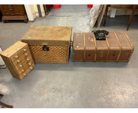 Two cabin/travelling trunks, one in wicker with canvas interior, the second wooden bound with metal mounts, a small pine five