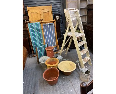 Two vintage folding deckchairs, terracotta pots, a bread bowl, galvanised watering cans and bucket, etc.