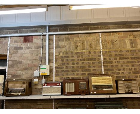 Five vintage wooden and bakelite cased valve radios including Wega, Regentone and Murphy.