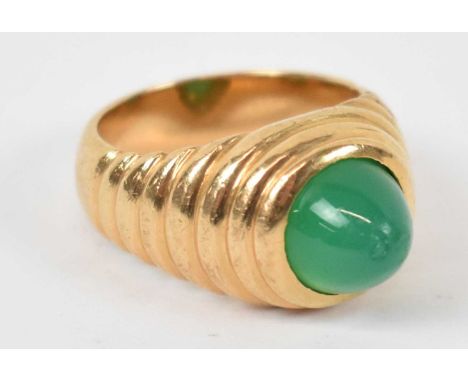 An 18ct yellow gold ring with central green stone, size G, approx 9.4g.
