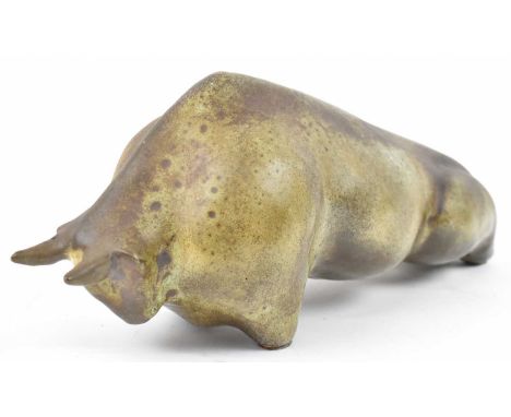 A studio ceramic model of a bull, signed to base, length 36cm.