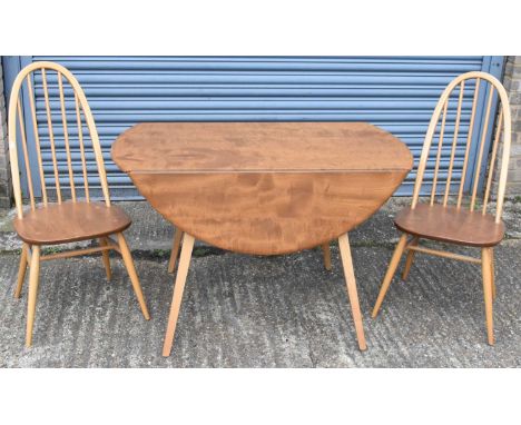 ERCOL; a mid century light oak drop-leaf dining table with four matching spindle back chairs, width 113cm (5).