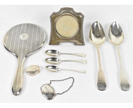 A small group of hallmarked silver items, including silver hand mirror, hallmarked Birmingham, a close pair of serving spoons