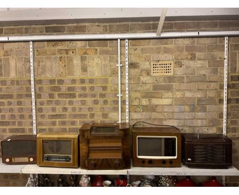 Five vintage wooden and bakelite cased valve radios including two Pye radios and another by Radio Rentals.