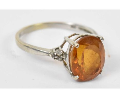 A 9ct white gold ring set with yellow stone, size P, approx 2.8g.