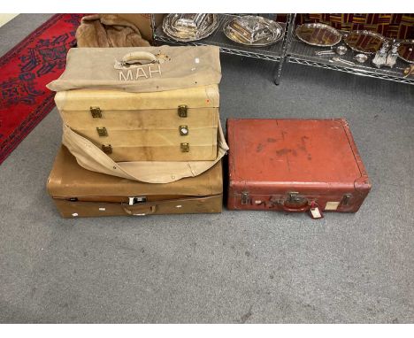 Two vintage suitcases, the largest measuring 74cms x 50cms and a pig skin travelling trunk measuring length 60cms, depth 35cm