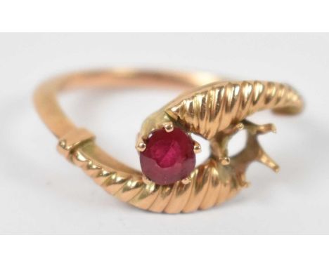 A yellow metal Italian ring with central ruby (af), approx 2.2g.