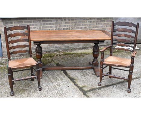 An oak rectangular refectory table on baluster turned supports 174 x 82cm, and a set of six rush seated ladder back chairs (4