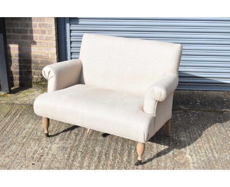 A modern beige two seater upholstered sofa, width 103cm, depth 68cm, height 87cm.