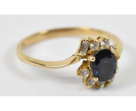 An 18ct yellow gold sapphire and diamond ring, size N, approx 2.5g.