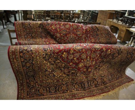 An Excellent Red And Blue Ground Persian Carpet With Successive Borders And Stylised Floral Motifs