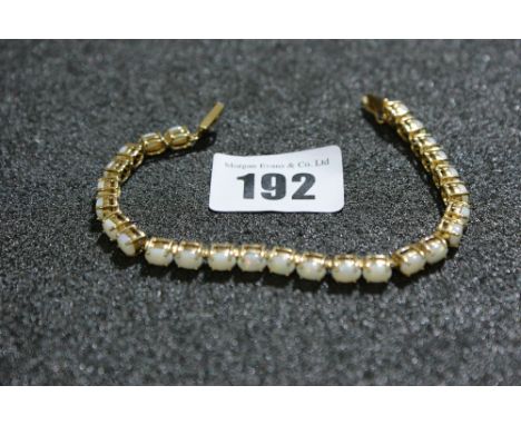 A 9 Carat Gold White Opal Set Bracelet