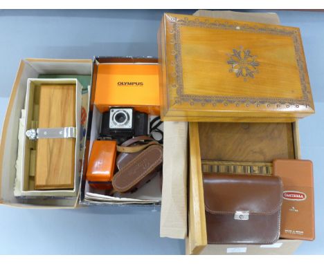 An Olympus AFC camera, two other cameras, Paxette and Coronet Victor, slides, three albums of stamps, tie-press, framed brush