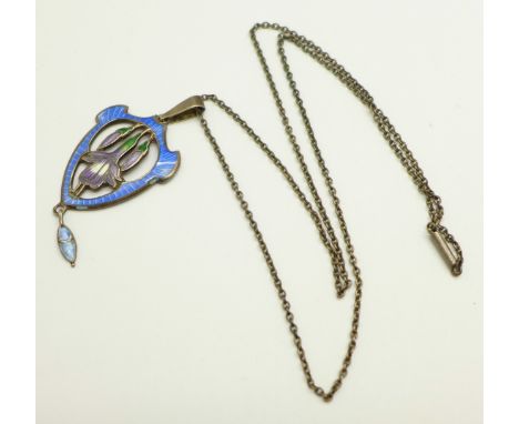 A sterling silver and enamel Art Nouveau pendant and chain, no makers mark, height without loop 42mm 