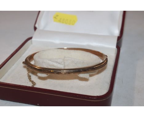 A 9ct gold bangle, approx. 6gms 