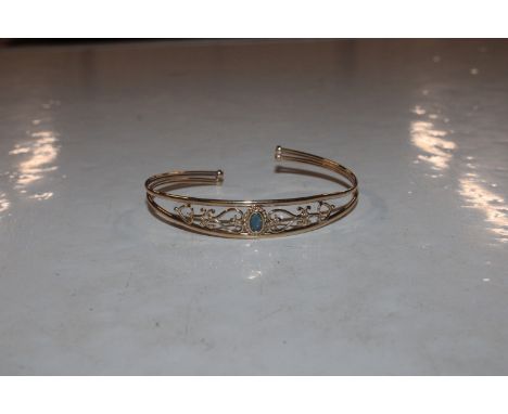 A 9ct gold and opal set bangle, approx. 5gms total weight