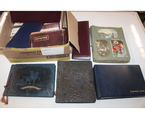 A box containing various albums of post-cards 