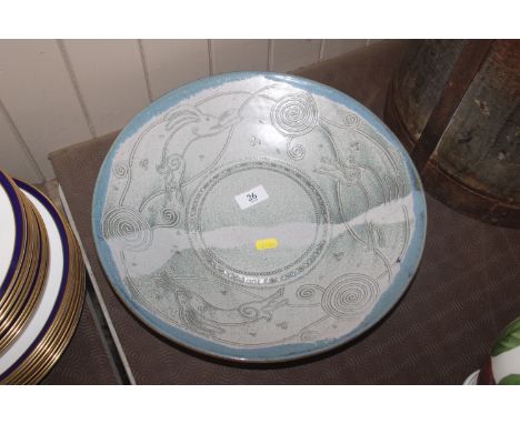 A Leon & Jenny Pettersson ceramic craft charger decorated leaping hares 