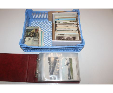 A box containing an album of post-cards and various loose post-cards 