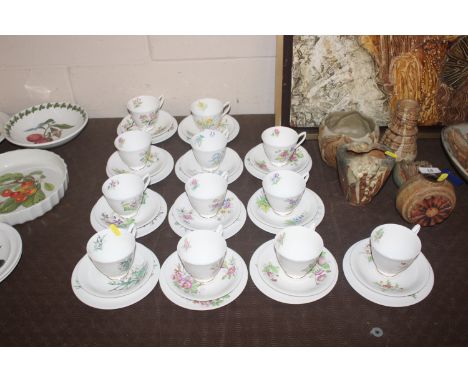 A collection of Royal Albert "Flowers of the Month" tea cups, saucers and side plates 