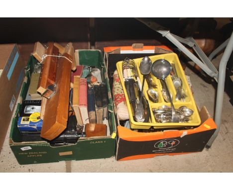 Two boxes containing various books, camera, silver plated flatware etc.