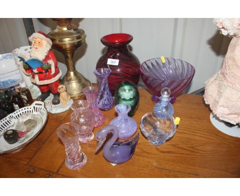 A quantity of coloured glassware to include Caithness, various vases, paperweights, bottle and stopper 