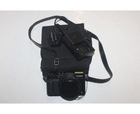 A Lumix Panasonic DMX-LC100 digital camera, having Leica lens and charger 