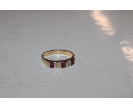 An 18ct gold ruby and diamond set ring, 4.5gms total weight, ring size R