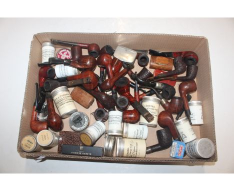 A box containing a large quantity of Dunhill and other pipes; Alfred Dunhill pipe mouthpiece, polish, a Dunhill pipe reamer, 