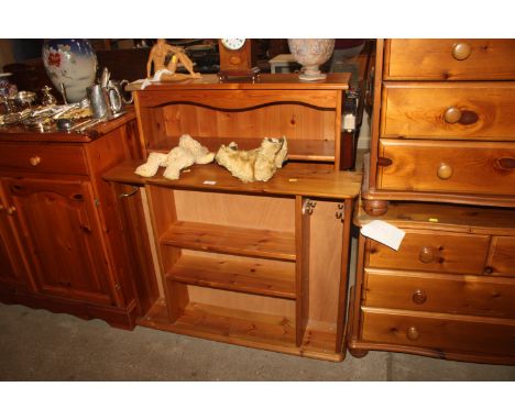 A pine open fronted bookcase and a pine hanging shelf 