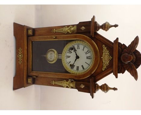 A CIRCA 1900 "SEIKOSHA" JAPANESE MANTEL CLOCK, carved crest, turned finials and decorative brass mounts, with chiming movemen